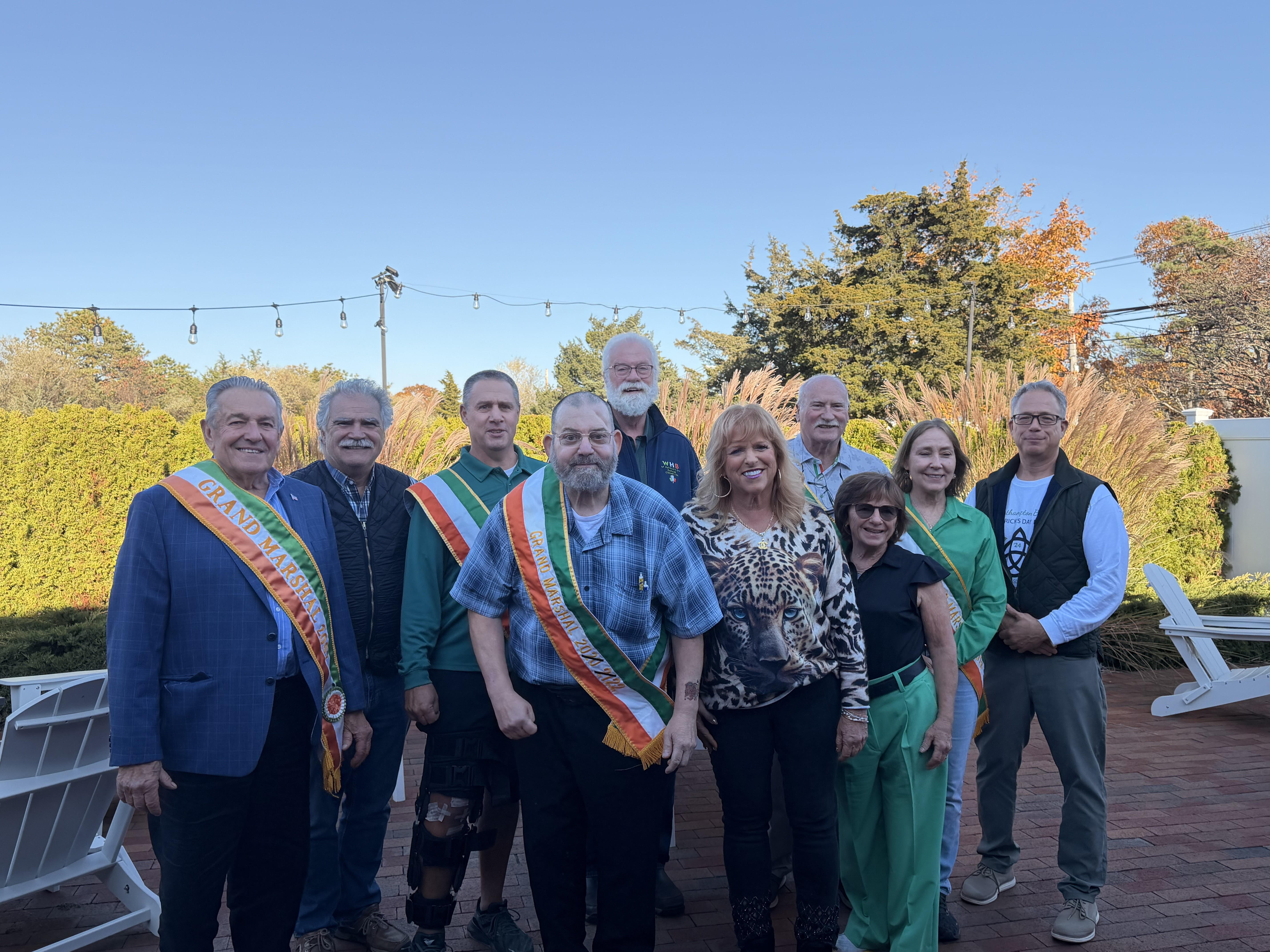 from left or right are past Grand Marshals, Bob Strebel, Aram Terchunian, Digger Koziarz, Preston Jankowski, Jim Hulme, Allyson Barone Scerri, Steve Frano, Patti Ziparo-Dalton, Lynne Jones and Parade Committee President Tim Laube. 